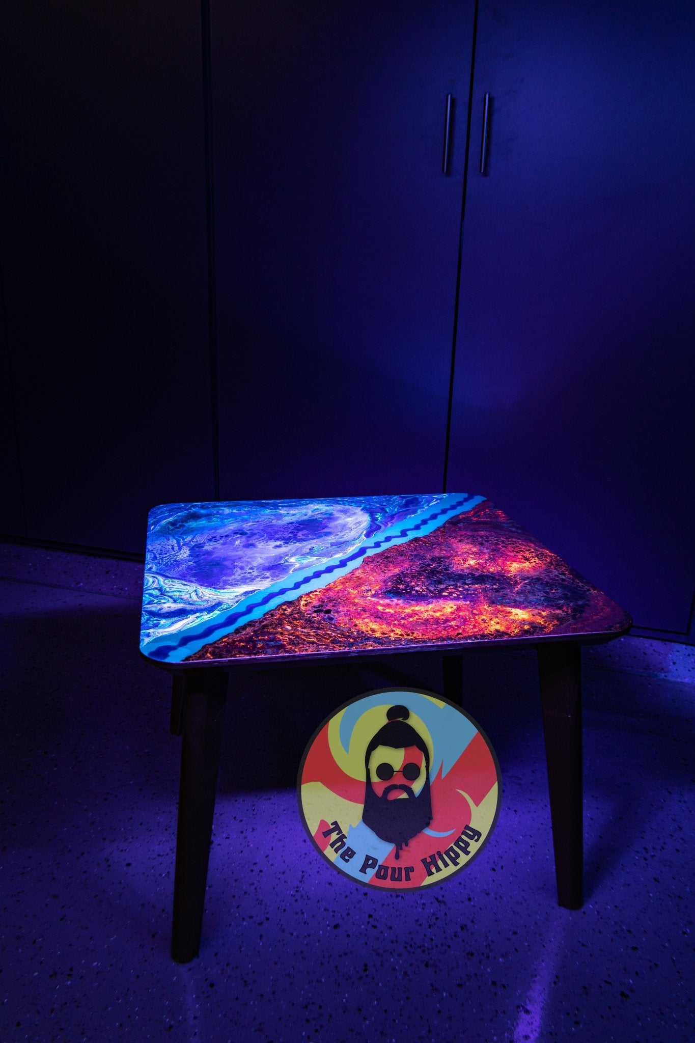 The Janus Divide, a blacklight fluorescent acrylic & resin coffee table